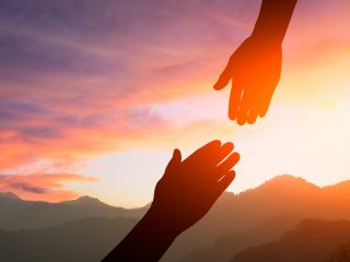 helping hand with the sky sunset background